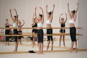 Gymnasts practice choreography during the recovery camp at the Academy