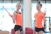 Young gymnasts during training with objects