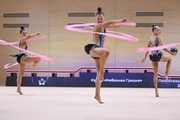 Gymnasts during an exercise with balls and ribbons