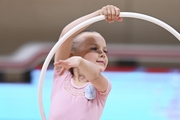 Young gymnast during an exercise with a hoop at the mAlinka tournament