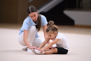 Academy coach Elizaveta Chernova with a young gymnast during the Academy selection process