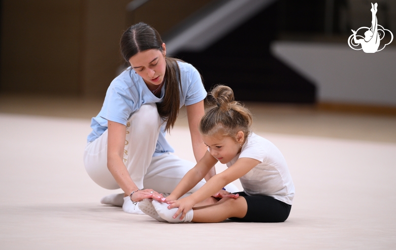 Academy coach Elizaveta Chernova with a young gymnast during the Academy selection process