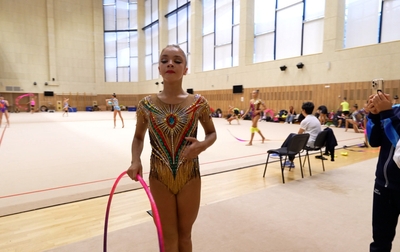 How do Academy gymnasts prepare before stepping onto the carpet at the Crystal Rose international tournament?
