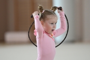 Young gymnast during an exercise with a jump rope