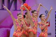 Group team gymnasts from St. Petersburg during an exercise with balls and hoops
