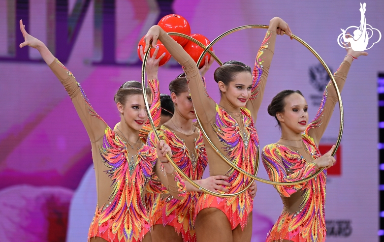 Group team gymnasts from St. Petersburg during an exercise with balls and hoops