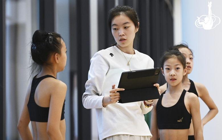 Gymnasts from China during the training session with the coach