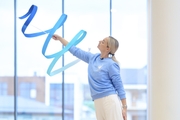 Academy coach Anna Ustsova during an exercise with a ribbon during a training session