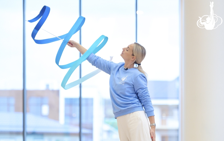 Academy coach Anna Ustsova during an exercise with a ribbon during a training session