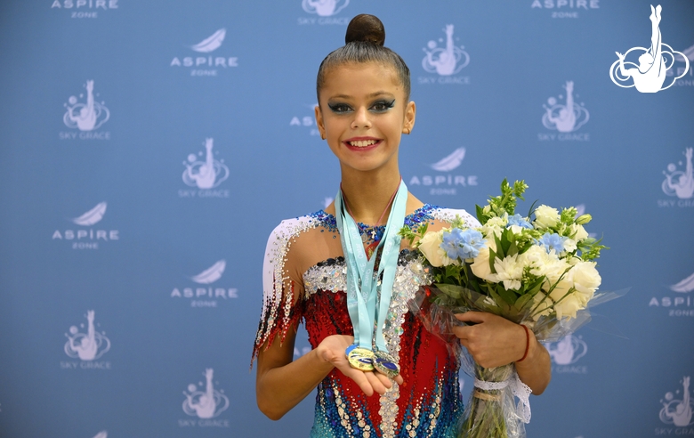 Karolina Tarasova with the international Sky Grace Cup tournament medals