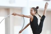 Gymnast doing an exercise with a hoop during a training session