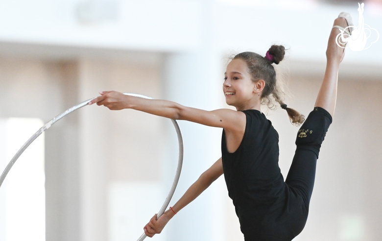 Gymnast doing an exercise with a hoop during a training session