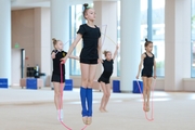 Gymnasts during an exercise with a jump rope