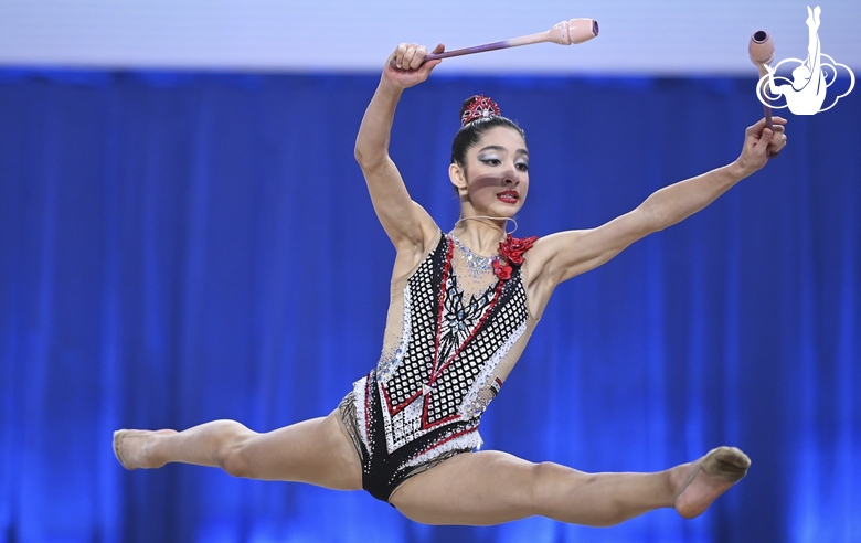 Maya Salum during an exercise with clubs