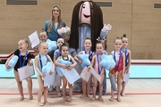 Academy coach Olga Frolova with young gymnasts at the mAlinka tournament