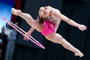 Diana Chugunikhina (Russia) jumping to the standing split during the hoop exercise