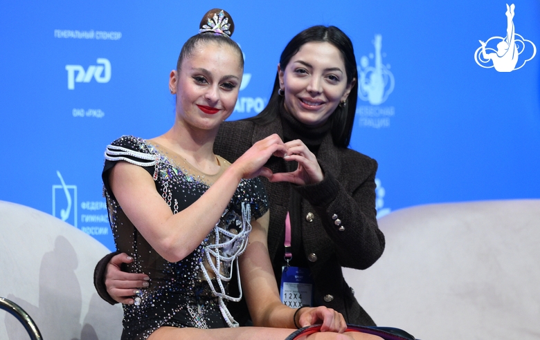 Silva Sargsyan with coach after an exercise with a hoop