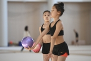 A young gymnast from China during the ball exercise