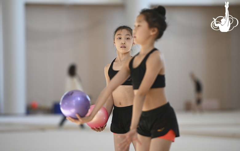 A young gymnast from China during the ball exercise