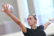 Maria Pobedushkina performs an element with a ball