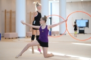 Gymnasts performing an exercise with hoops