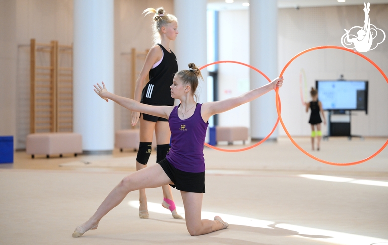 Gymnasts performing an exercise with hoops