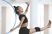 Asel Arapova  during an exercise with a hoop during preparation training for the BRICS Games