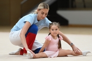 Academy Coach Anna Ustsova with a young gymnast during the selection