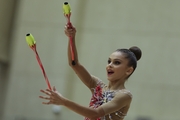 Gymnast during an exercise with clubs