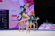 Group team gymnasts from Belarus during an exercise with balls and hoops