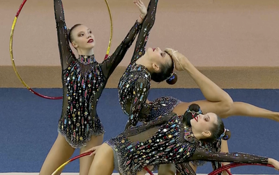 Performance of the Zhemchuzhina Rhythmic Gymnastics Center team from St.Petersburg with five hoops at the Sky Grace Cup