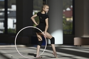 Kristina Voitenko does a hoop exercise