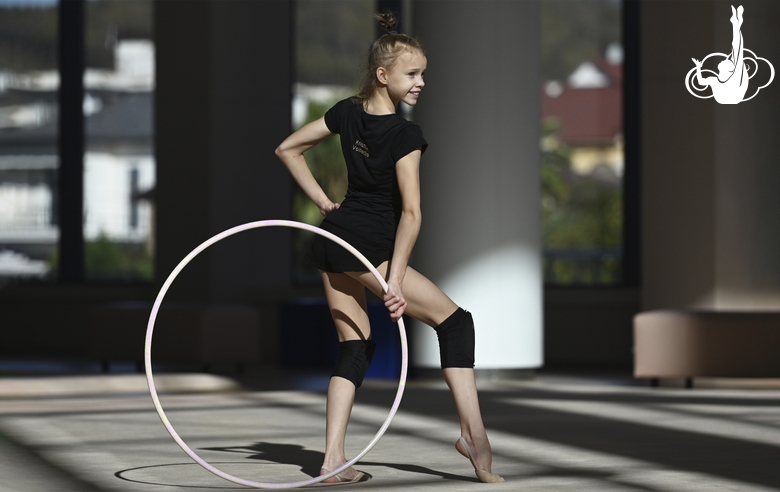 Kristina Voitenko does a hoop exercise