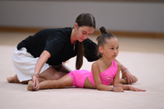 Academy coach Elizaveta Chernova with a young gymnast during the selection process