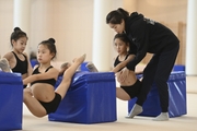 Chinese gymnasts stretching