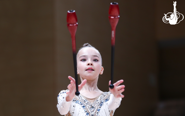 Gymnast during an exercise with clubs at an assessment training session