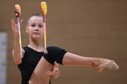 Gymnast during an exercise with clubs during floor testing