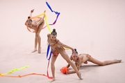 Gymnasts during an exercise with balls and ribbons