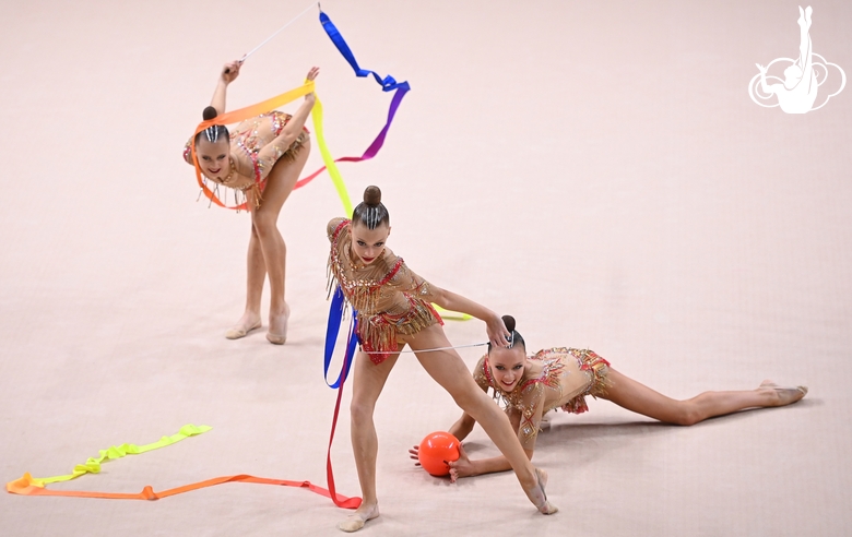 Gymnasts during an exercise with balls and ribbons