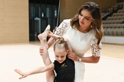 Olympic champion Alina Kabaeva with a young participant during the selection process