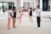 Coach Pooja Surve, gymnast Aryaa Nitesh Kadam and Academy specialist Elizaveta Chernova during training