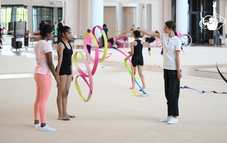 Coach Pooja Surve, gymnast Aryaa Nitesh Kadam and Academy specialist Elizaveta Chernova during training