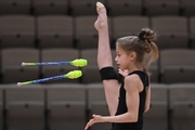 Gymnast during an exercise with clubs during floor testing