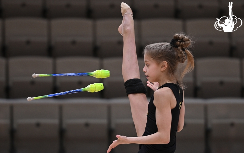 Gymnast during an exercise with clubs during floor testing