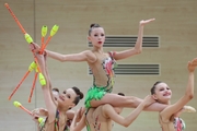 Gymnasts during an exercise with clubs