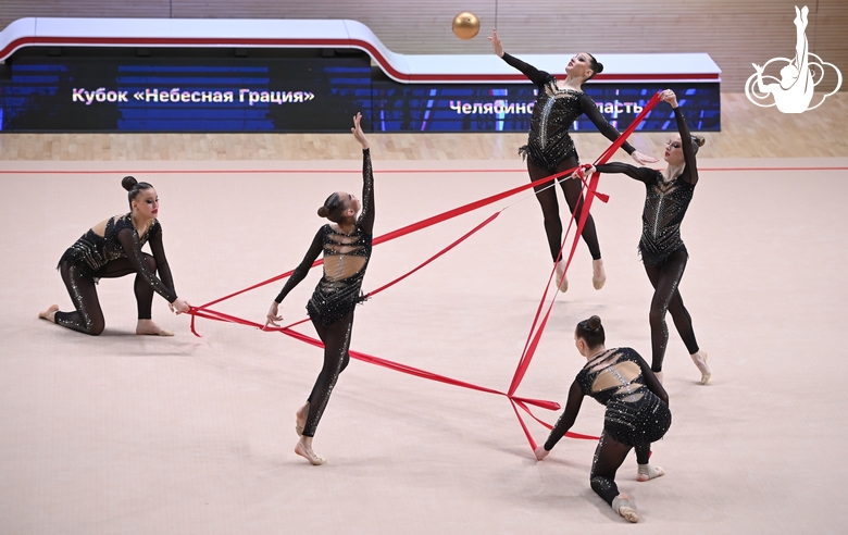 Gymnasts during an exercise with balls and ribbons