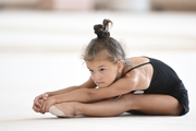 Young gymnast during training