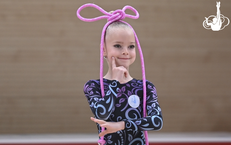 Young gymnast during an exercise with a jump rope at the mAlinka tournament