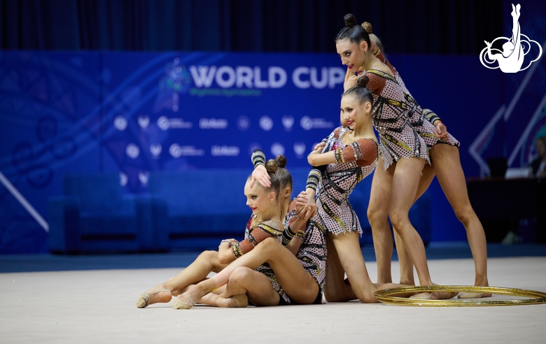 Group gymnasts during an exercise with hoops and clubs