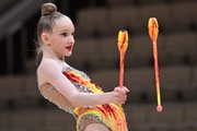 Lada Yakovleva during an exercise with clubs at a control training session